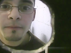 Thin gay white guy sucking off black cocks at a gloryhole