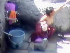 Tourist spied a poor woman washing up