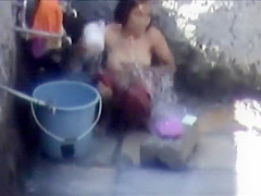 Tourist spied a poor woman washing up
