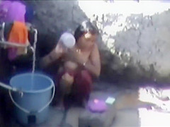 Tourist spied a poor woman washing up