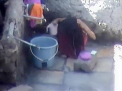 Tourist spied a poor woman washing up