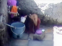 Tourist spied a poor woman washing up