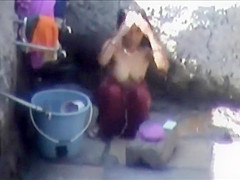 Tourist spied a poor woman washing up