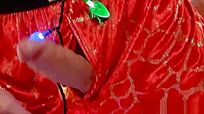 Twink tied with christmas lights wanks his big dick solo
