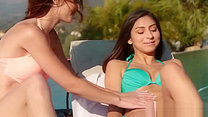 Two very horny young lesbian babes lick each other vaginas by the pool