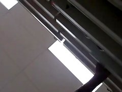 UPSKIRT--slim asian with a fat pussy peeking thru