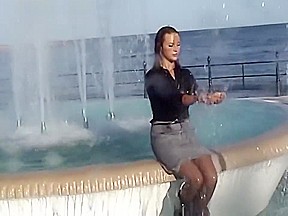 Wetlook fountain: Long black high heel boots, pantyhose, gray skirt