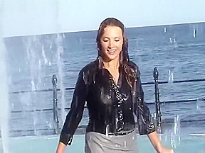 Wetlook fountain: Long black high heel boots, pantyhose, gray skirt