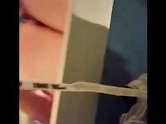 Woman is taking her clothes off in a dressing room