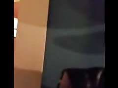 Woman is taking her clothes off in a dressing room