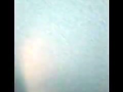Woman is taking her clothes off in a dressing room