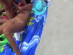 Young Asian wife having sex at beach
