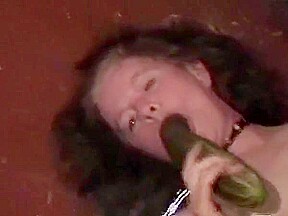 Zuchinni sucking chained milf takes load in mouth