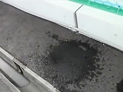 Desperate hitchhiker pees her jeans in a parking lot