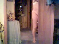 milf undressing in bed room