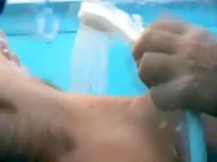video of couple showering each other in beach cabin